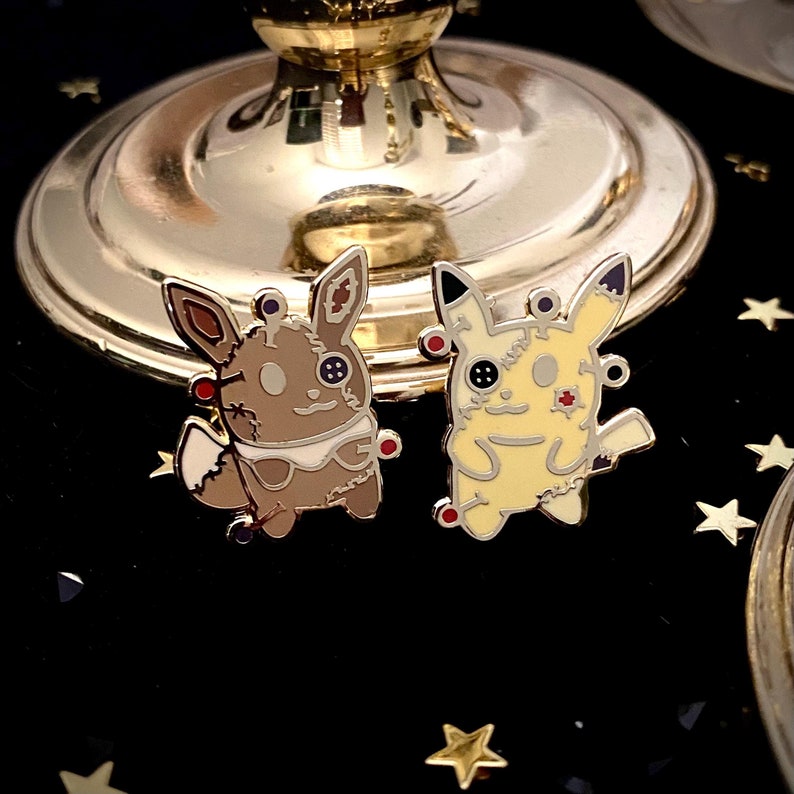 Eevee and Pika Voodoo Doll Enamel Pin