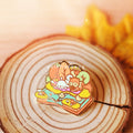 Story of Autumn Enamel Pin: Cosy Riverside Picnic